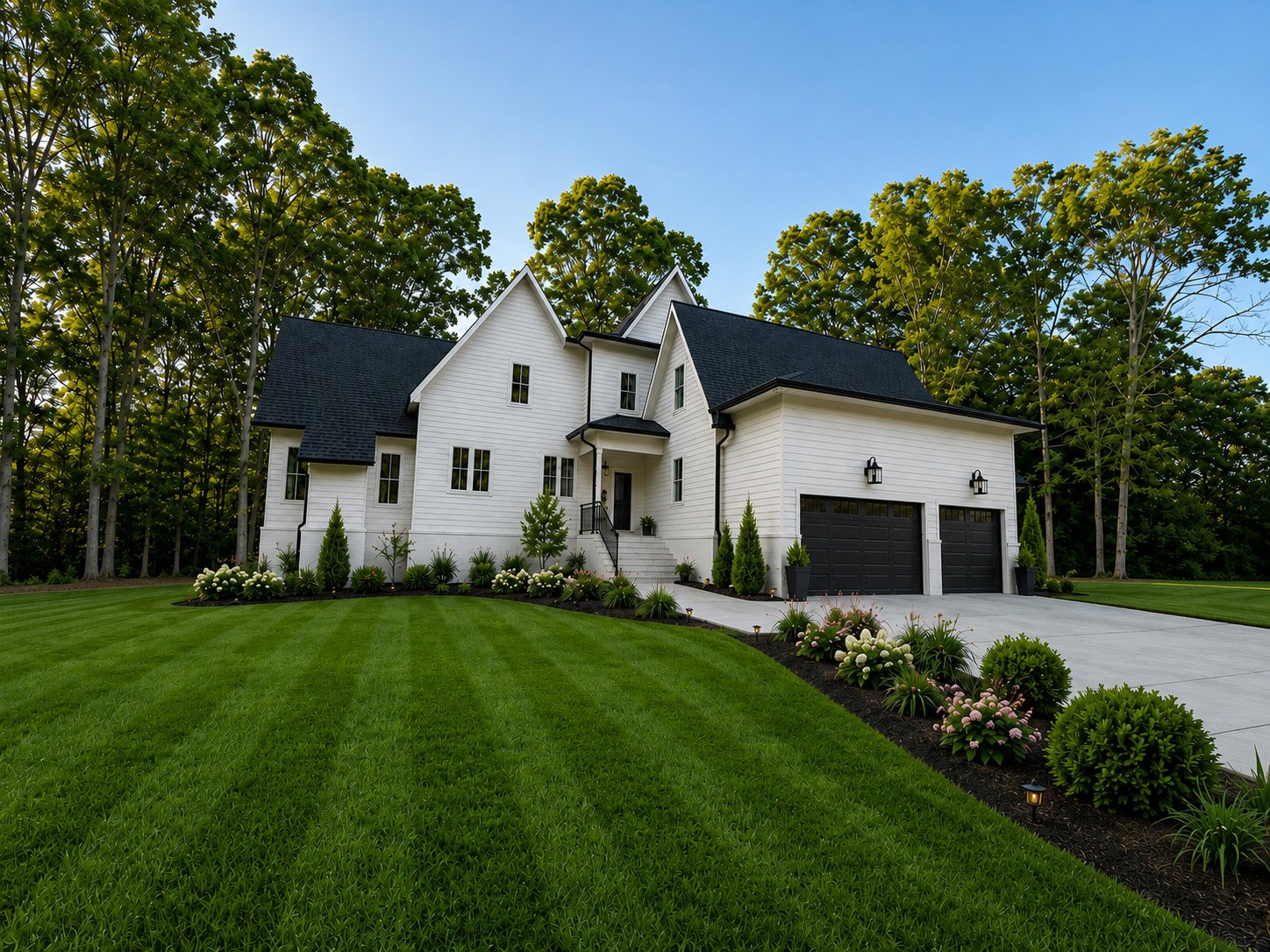 Front elevation with steep gables, board-and-batten siding and a three-car garage
